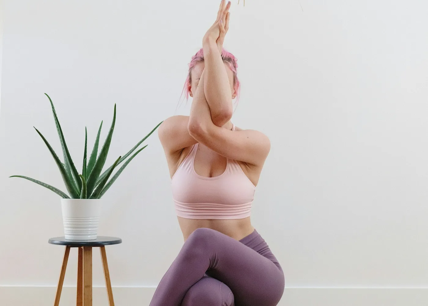 A woman in a balancing pose