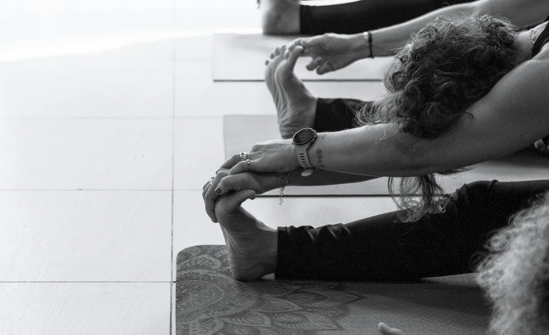 Students stretching in a bright studio